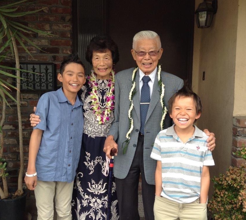 Dylan and Kyle with their grandparents at the front door